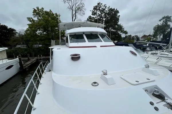 Slide: The Image of Crosswater Passagemaker 49 yacht, 2001 model, docked with trees in the background. - 34