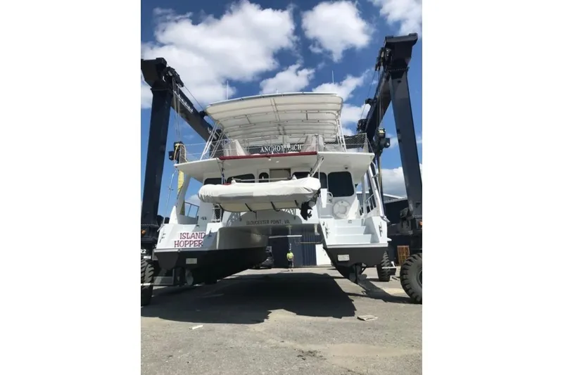 Slide: The Image of Crosswater Passagemaker 49 yacht, 2001 model, on a lift at a marina. - 38