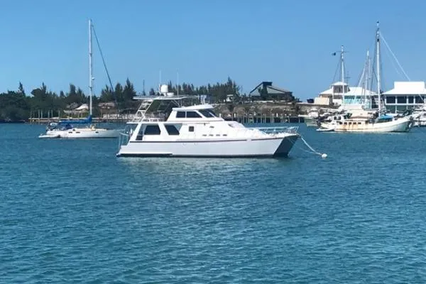 Slide: The Image of Crosswater Passagemaker 49 yacht from 2001 anchored in a serene harbor. - 41