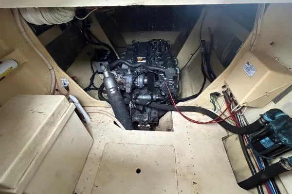 Slide: The Image of Engine room of 2001 Crosswater Passagemaker 49 with visible machinery and wiring. - 49