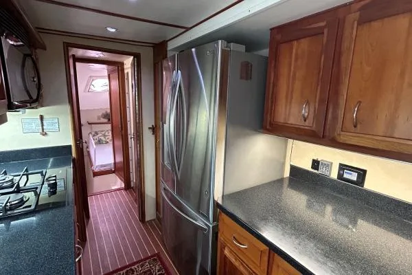 Slide: The Image of Galley kitchen in 2001 Crosswater Passagemaker 49 yacht with stainless steel appliances. - 5