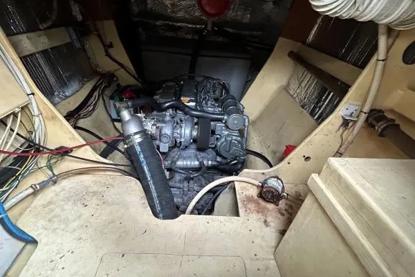 Slide: The Image of Engine room of 2001 Crosswater Passagemaker 49, showcasing mechanical components and wiring. - 50