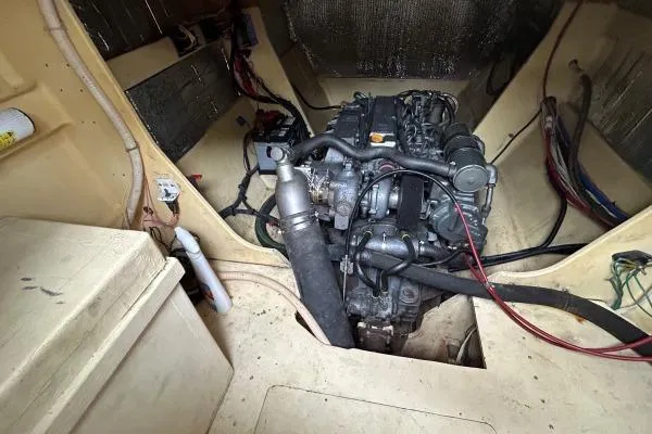 Slide: The Image of Engine compartment of 2001 Crosswater Passagemaker 49 boat, showcasing mechanical components. - 52