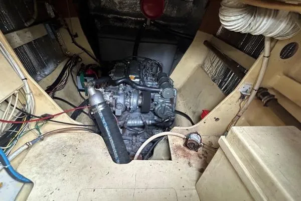 Slide: The Image of Engine compartment of 2001 Crosswater Passagemaker 49 boat, showcasing mechanical components. - 53