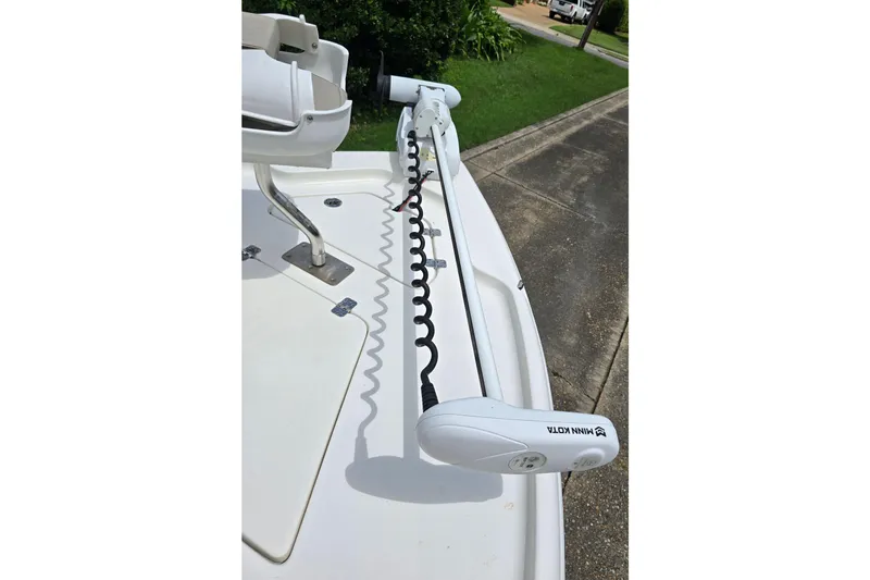 Slide: The Image of 2023 Key West 188 Bay Reef boat with Minn Kota trolling motor on deck. - 21