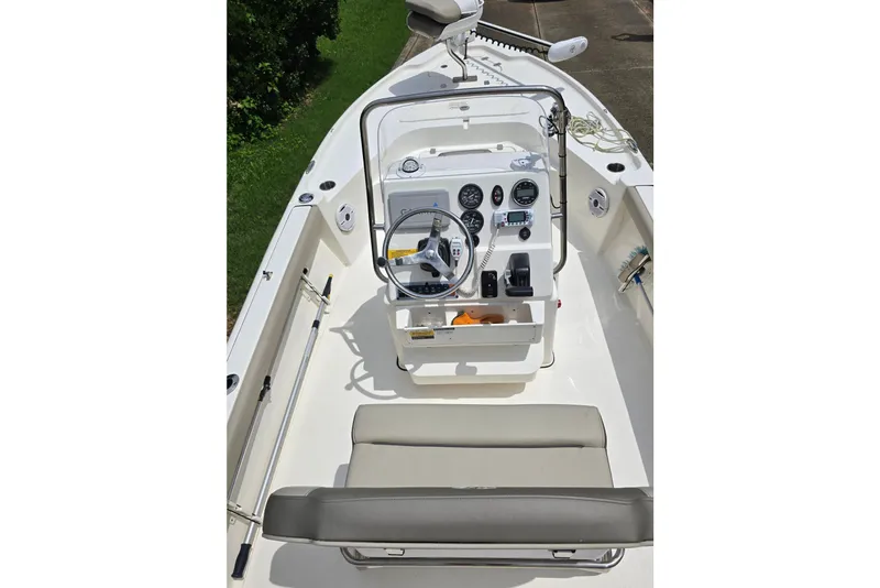 Slide: The Image of 2023 Key West 188 Bay Reef boat interior with steering console and seating. - 23