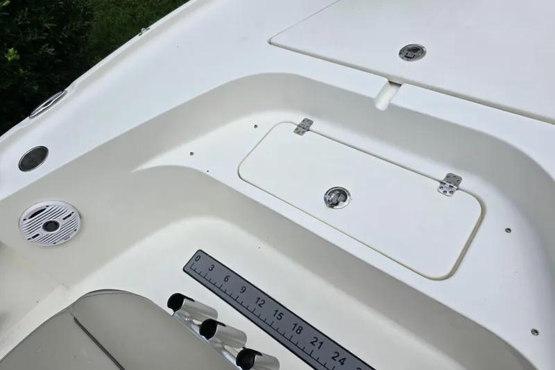 Slide: The Image of 2023 Key West 188 Bay Reef boat deck with storage compartment and ruler. - 24