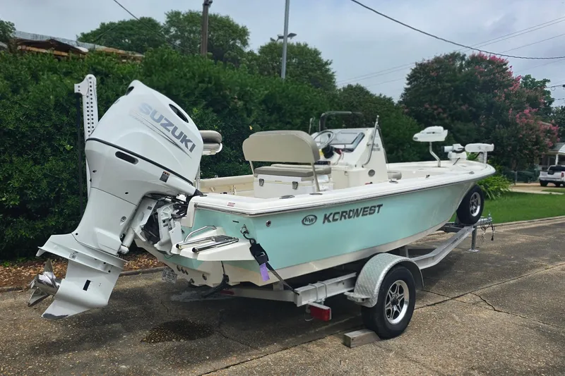 Slide: The Image of 2023 Key West 188 Bay Reef boat with Suzuki outboard motor on trailer. - 3