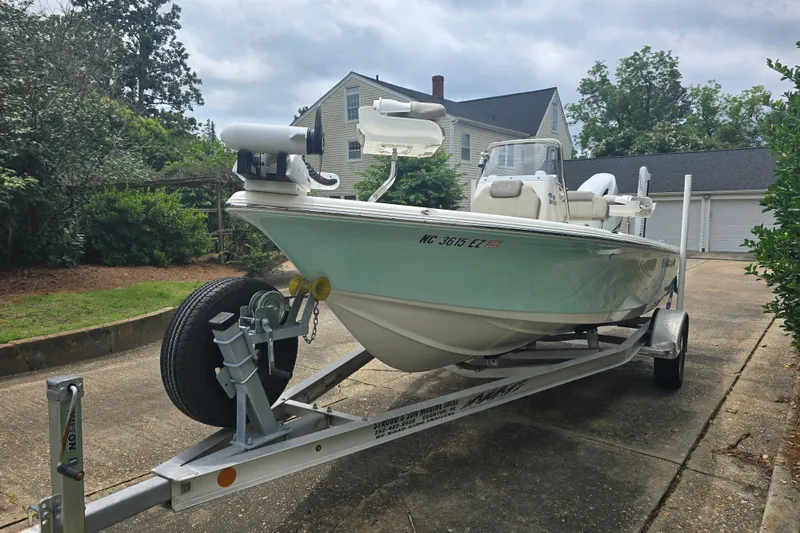 Slide: The Image of 2023 Key West 188 Bay Reef boat on trailer in residential driveway. - 4