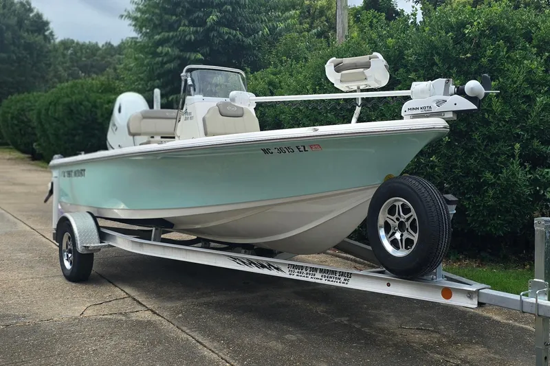Slide: The Image of 2023 Key West 188 Bay Reef boat on trailer, parked outdoors. - 5