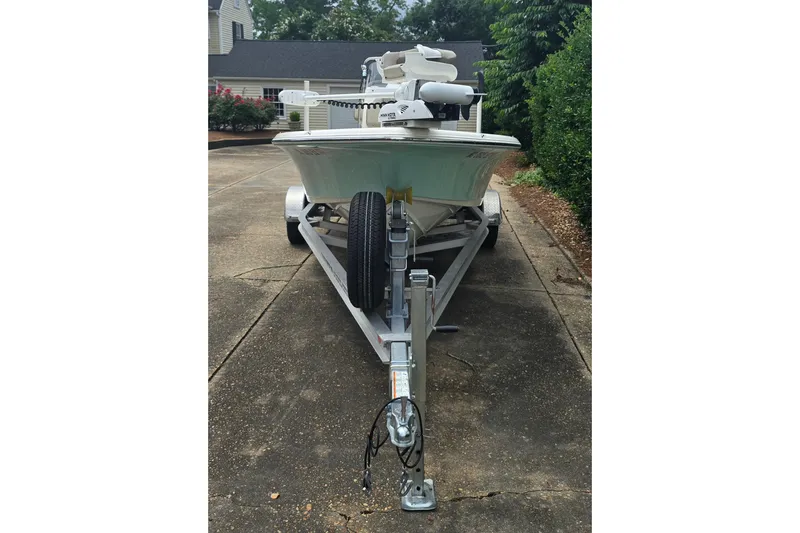 Slide: The Image of 2023 Key West 188 Bay Reef boat on trailer in driveway. - 6