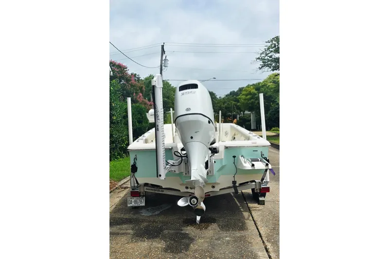 Slide: The Image of 2023 Key West 188 Bay Reef boat with outboard motor on a trailer. - 7