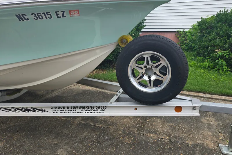 Slide: The Image of 2023 Key West 188 Bay Reef boat on trailer, featuring Road King Trailers branding. - 9