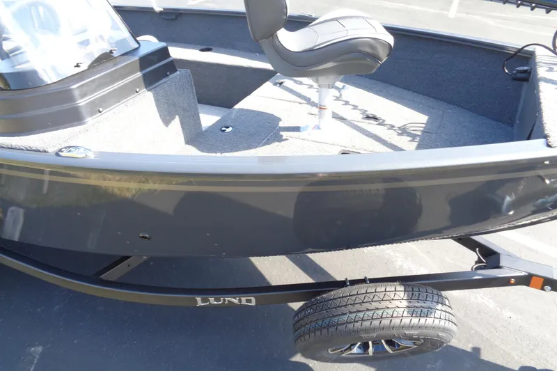 Slide: The Image of 2026 Lund 1650 Rebel XL SS boat on trailer, featuring a sleek design and comfortable seating. - 11