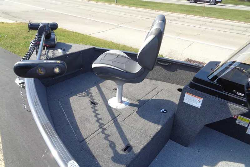 Slide: The Image of 2026 Lund 1650 Rebel XL SS boat interior with seat and trolling motor. - 22