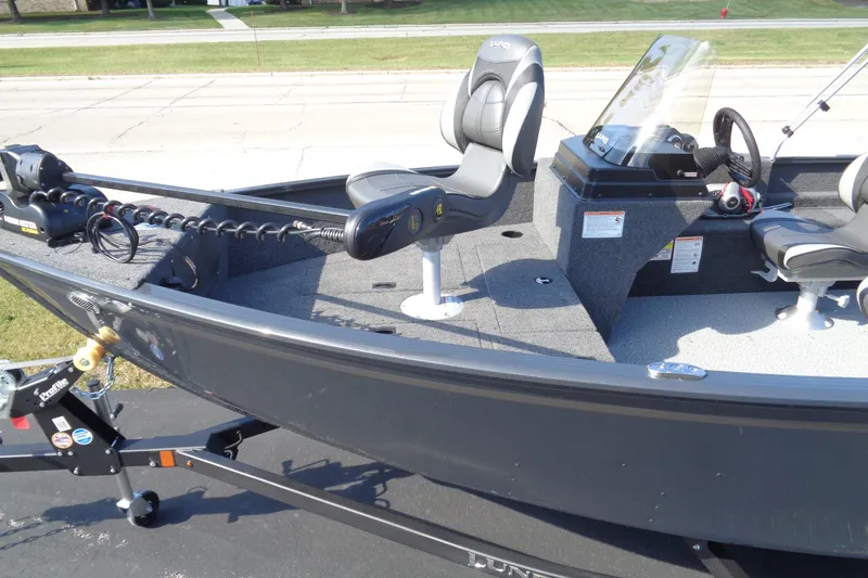 Slide: The Image of 2026 Lund 1650 Rebel XL SS fishing boat with seating and control console. - 3