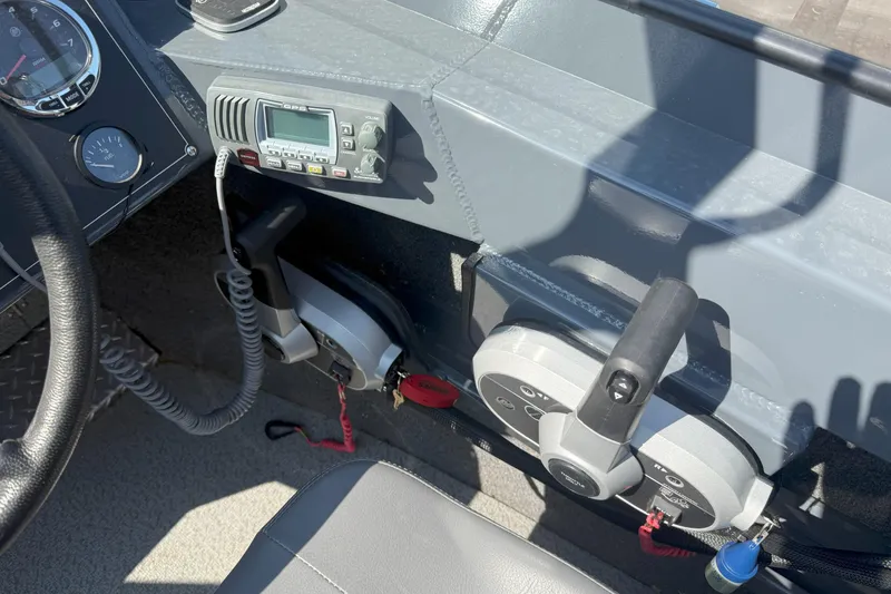 Slide: The Image of Control panel of 2021 Hewescraft 210 Sea Runner ET boat with steering wheel and radio. - 12