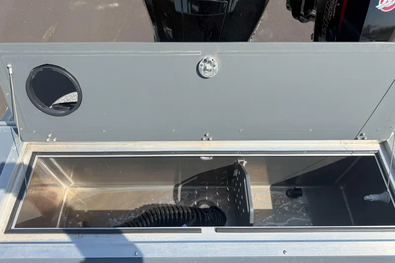 Slide: The Image of Open storage compartment on a 2021 Hewescraft 210 Sea Runner ET boat. - 7