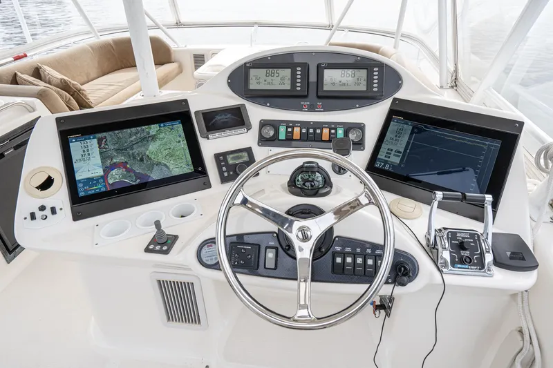 Slide: The Image of 2009 Riviera 47 Open Flybridge Series II helm with advanced navigation and control systems. - 11
