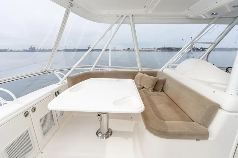 Slide: The Image of Luxurious 2009 Riviera 47 Open Flybridge Series II interior with beige seating and ocean view. - 14