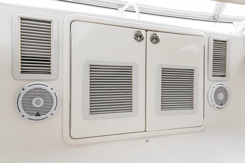 Slide: The Image of 2009 Riviera 47 Open Flybridge Series II boat interior with vents and speakers. - 15