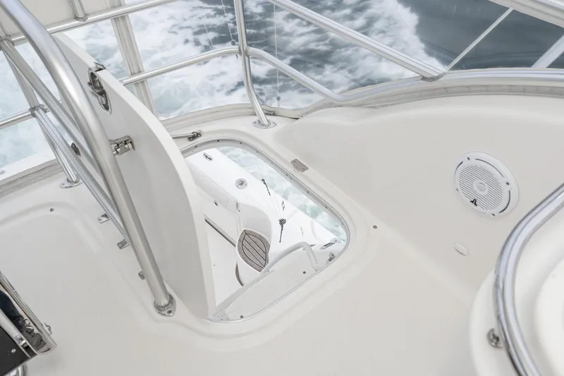Slide: The Image of 2009 Riviera 47 Open Flybridge Series II interior with ocean view through hatch. - 17