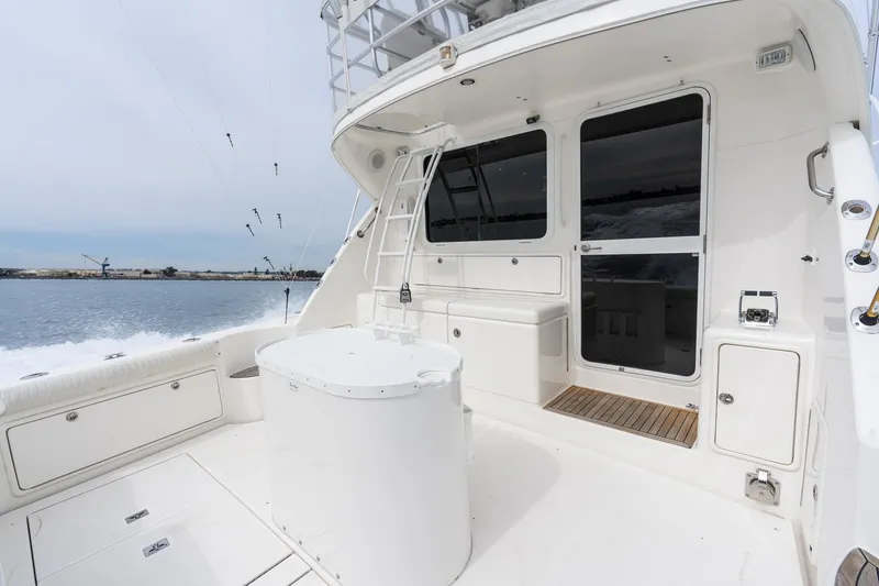 Slide: The Image of 2009 Riviera 47 Open Flybridge Series II yacht deck with seating and ocean view. - 19