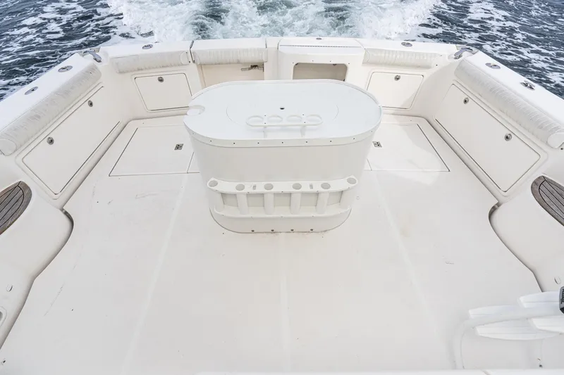 Slide: The Image of 2009 Riviera 47 Open Flybridge Series II boat deck with seating and storage compartments. - 20