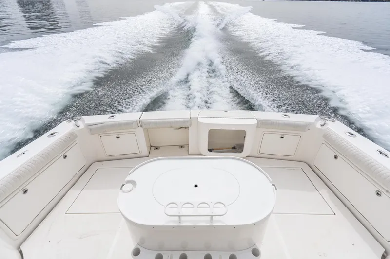 Slide: The Image of 2009 Riviera 47 Open Flybridge Series II cruising, view from deck with wake trail. - 21