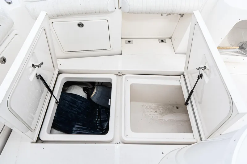 Slide: The Image of Open storage compartments on a 2009 Riviera 47 Open Flybridge Series II boat. - 22