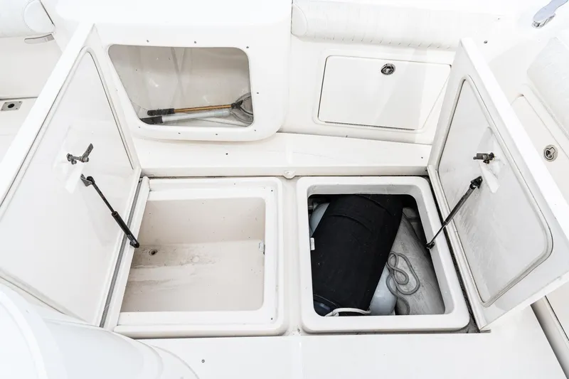 Slide: The Image of Open storage compartments on a 2009 Riviera 47 Open Flybridge Series II boat. - 23