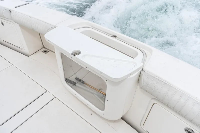 Slide: The Image of 2009 Riviera 47 Open Flybridge Series II boat deck with storage compartment and ocean view. - 24