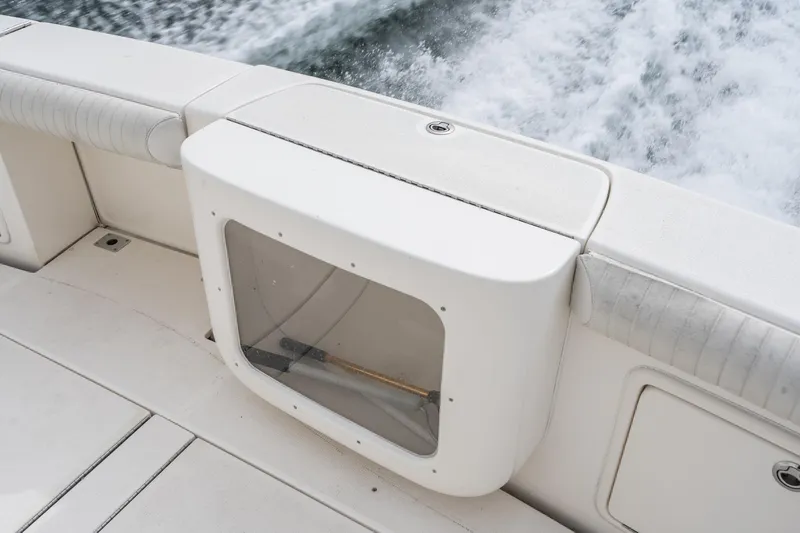 Slide: The Image of 2009 Riviera 47 Open Flybridge Series II boat deck with storage compartment and ocean view. - 28