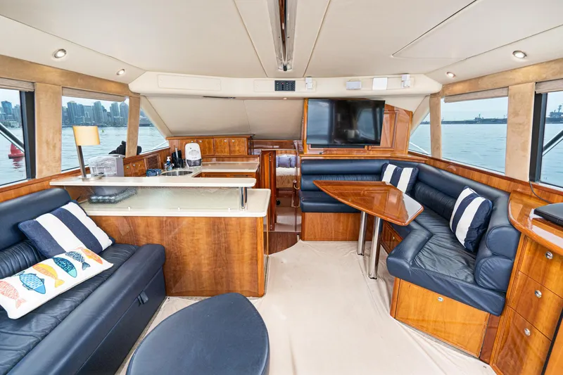 Slide: The Image of Luxurious interior of 2009 Riviera 47 Open Flybridge Series II yacht with elegant seating and dining area. - 37