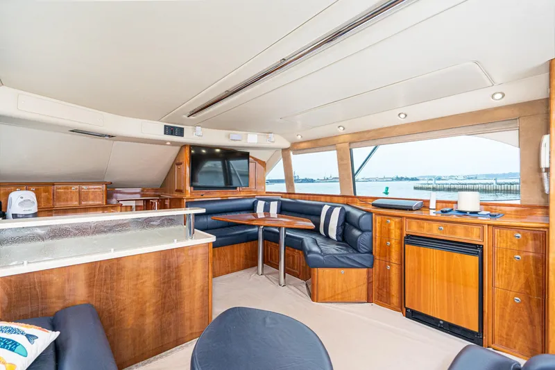 Slide: The Image of Luxurious interior of 2009 Riviera 47 Open Flybridge Series II yacht with elegant wood finishes. - 38