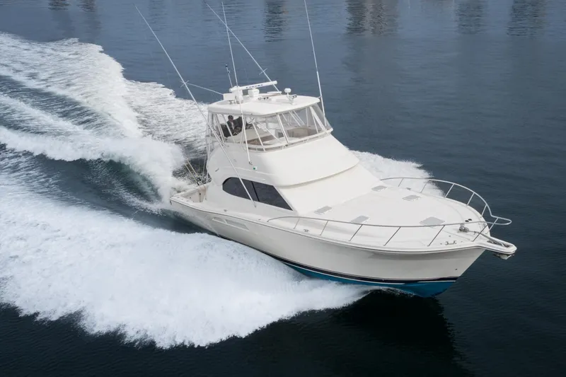 Slide: The Image of 2009 Riviera 47 Open Flybridge Series II cruising on calm waters. - 4