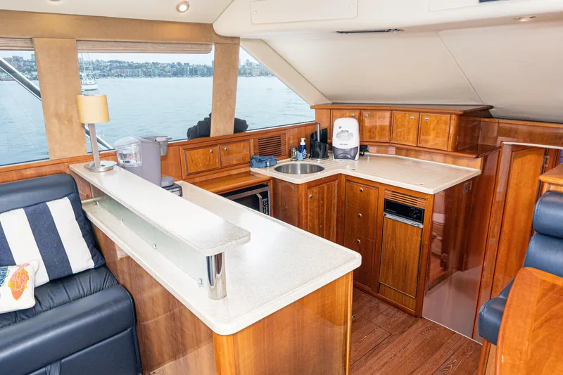 Slide: The Image of Luxurious interior of 2009 Riviera 47 Open Flybridge Series II yacht with modern kitchen amenities. - 41