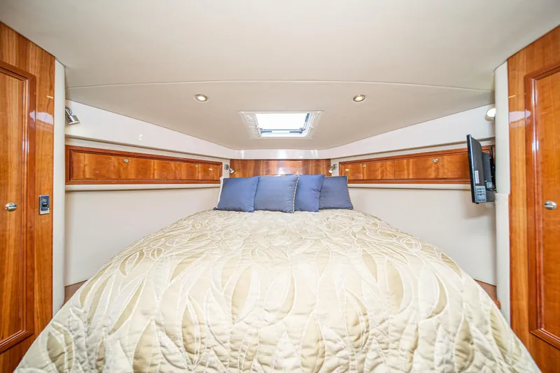 Slide: The Image of Luxurious bedroom interior of 2009 Riviera 47 Open Flybridge Series II yacht. - 46