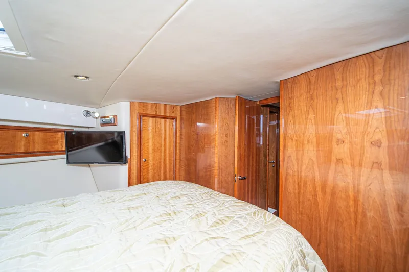 Slide: The Image of Luxurious cabin interior of 2009 Riviera 47 Open Flybridge Series II yacht. - 47