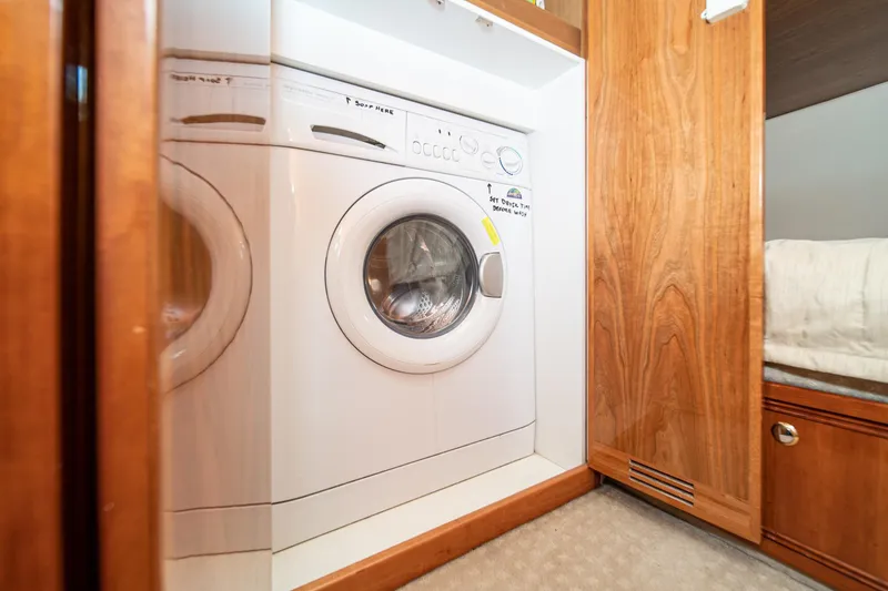 Slide: The Image of Washing machine in 2009 Riviera 47 Open Flybridge Series II yacht interior. - 54