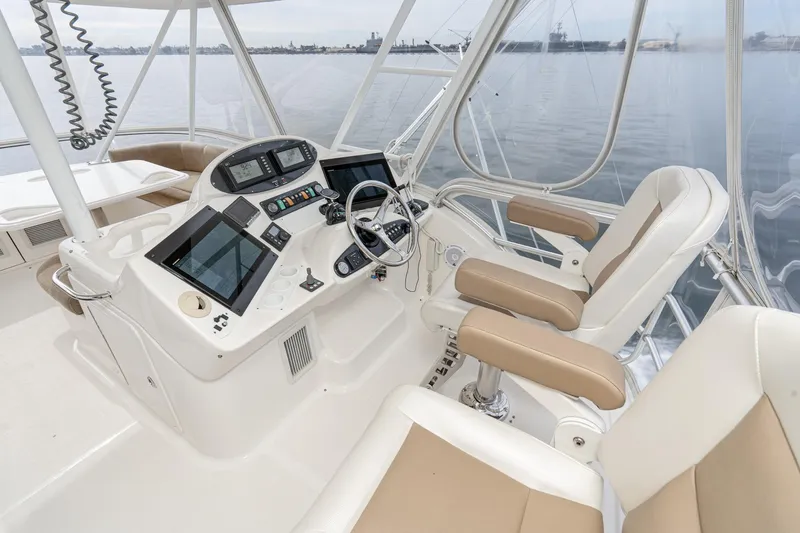 Slide: The Image of 2009 Riviera 47 Open Flybridge Series II helm with modern controls and comfortable seating. - 9