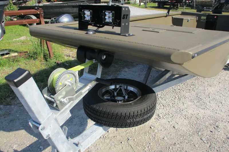 Slide: The Image of 2026 Gator Tail 1748 boat on trailer with spare tire and winch. - 12
