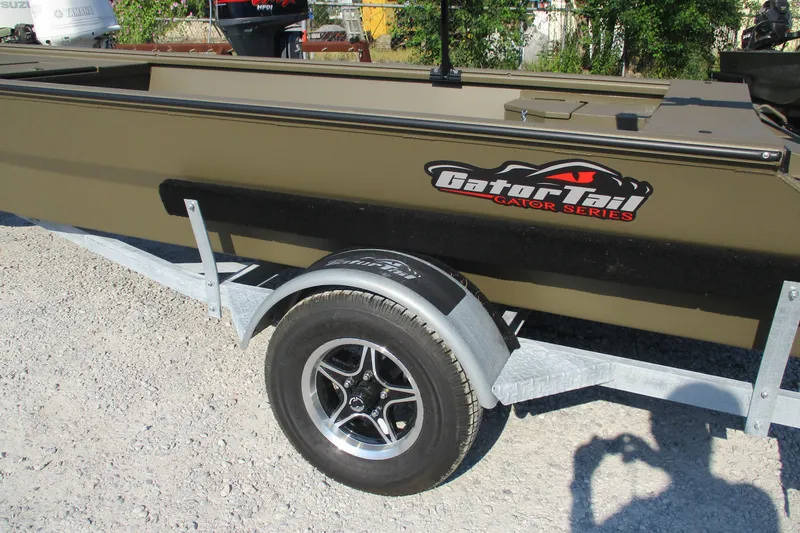 Slide: The Image of 2026 Gator Tail 1748 boat on trailer, featuring Gator Series branding. - 2