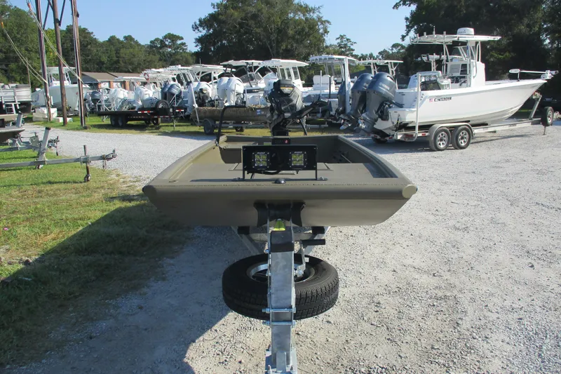 Slide: The Image of 2026 Gator Tail 1748 boat on trailer, surrounded by various boats in a dealership lot. - 3