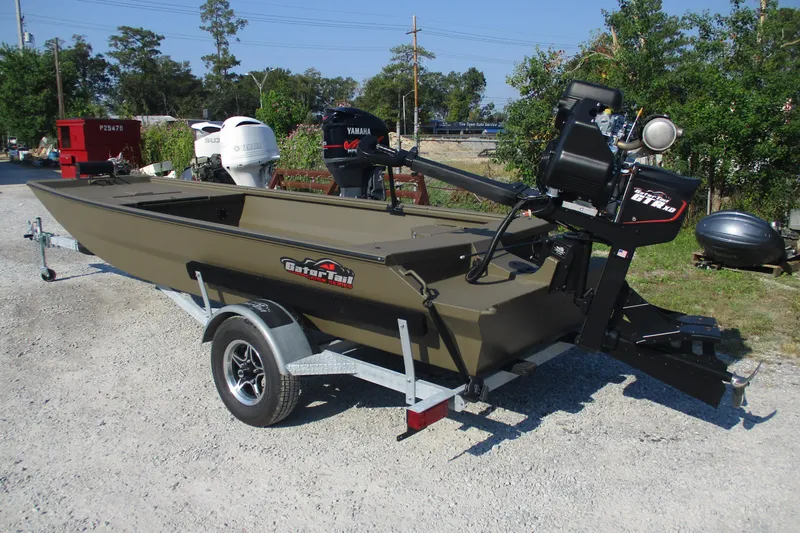 Slide: The Image of 2026 Gator Tail 1748 boat on trailer with outboard motor in outdoor setting. - 4