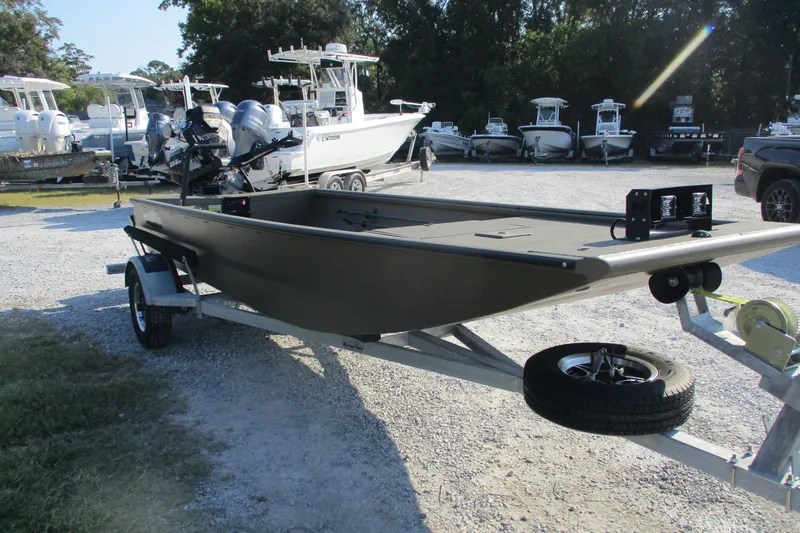 Slide: The Image of 2026 Gator Tail 1748 boat on trailer in a marina parking lot. - 6