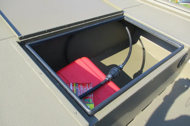 Slide: The Image of 2026 Gator Tail 1748 boat compartment with red fuel tank and hose. - 7