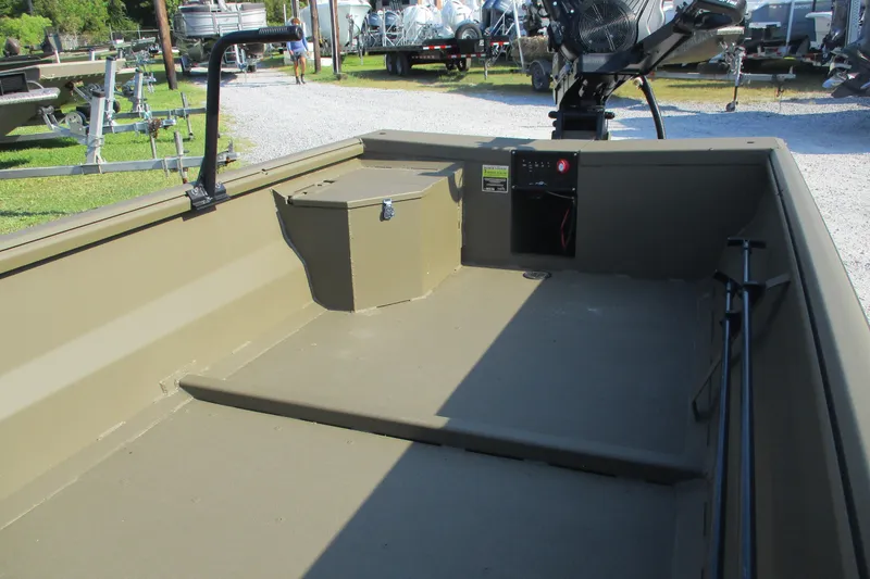 Slide: The Image of 2026 Gator Tail 1748 boat interior with control panel and storage compartment. - 8