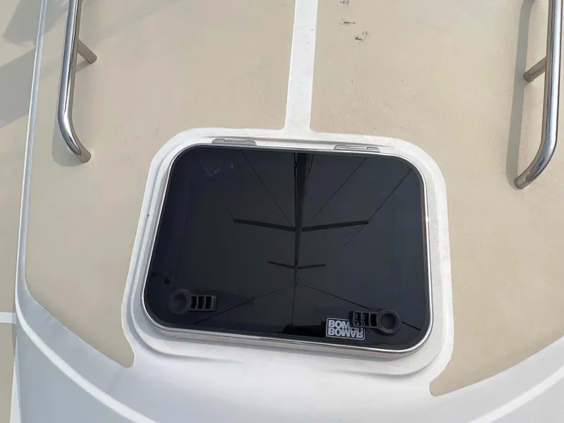 Slide: The Image of Hatch on 2007 Tartan 3400 sailboat deck with stainless steel handrails. - 17