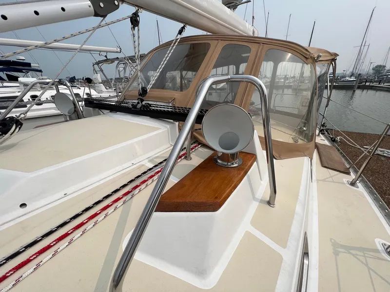 Slide: The Image of 2007 Tartan 3400 sailboat deck with stainless steel railings and cockpit enclosure. - 21